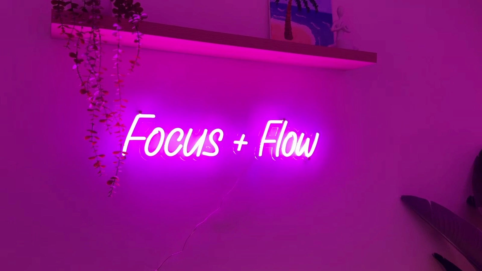 Completed pink LED neon sign mounted and illuminated on a wall