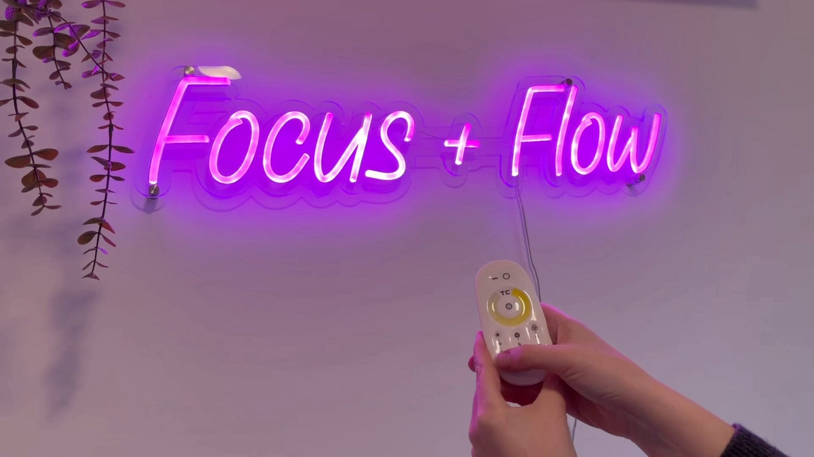 Testing a wall-mounted LED neon sign with remote dimmer