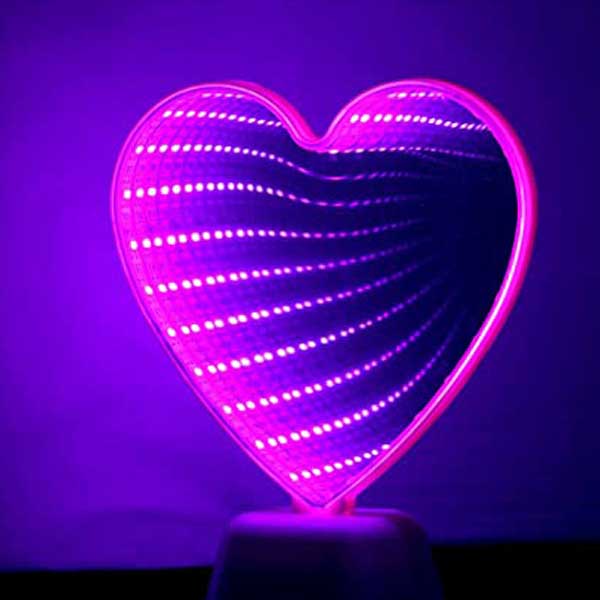 Close-up of evenly spaced LED reflections inside an infinity mirror sign