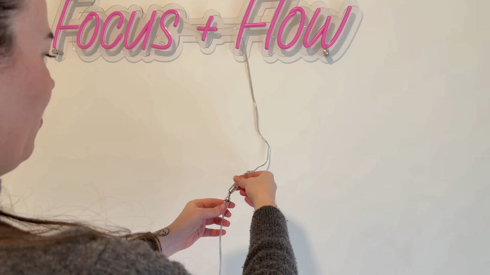Connecting the low-voltage power cable to an LED neon sign