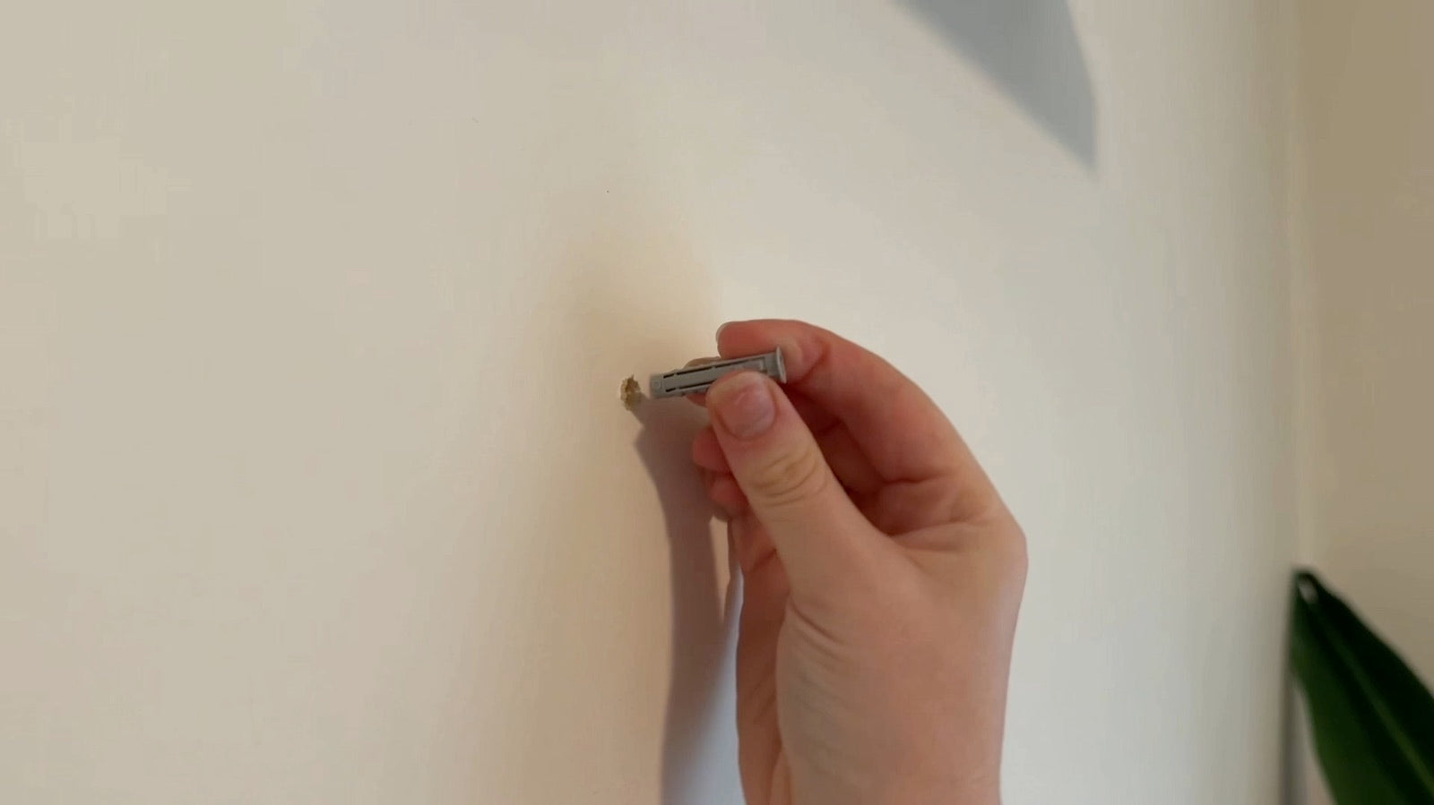 Inserting a wall anchor for an LED neon sign installation