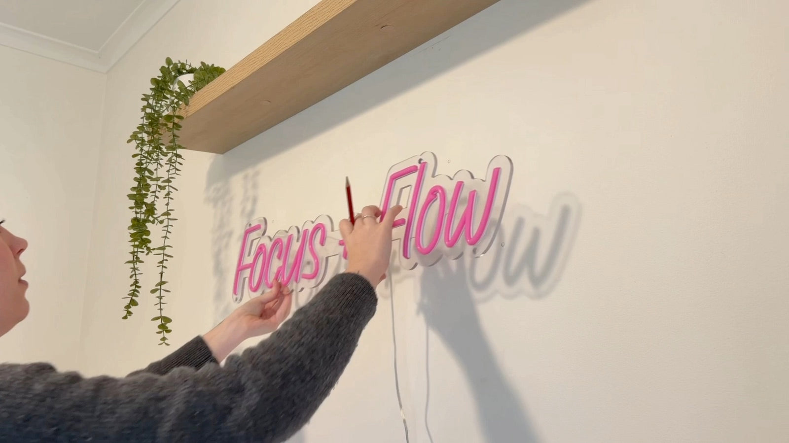 Marking mounting holes through an acrylic neon sign backing