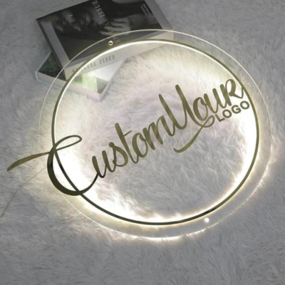 Round clear acrylic logo sign with soft perimeter illumination